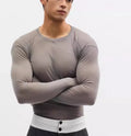 Black slim-fit long sleeve pullover top with mesh see-through texture.