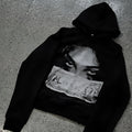 Black women's hoodie with cartoon print design in loose fit polyester fabric