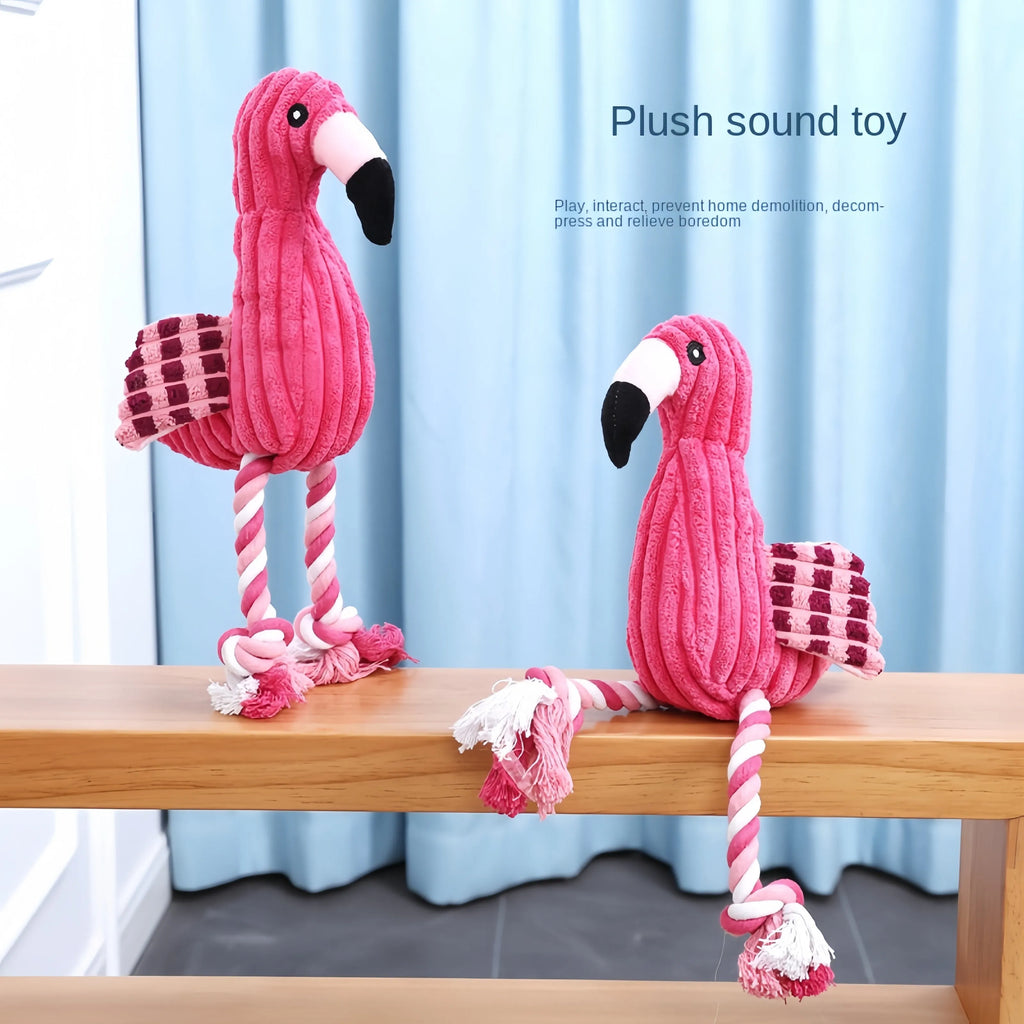 Pink corduroy animal-shaped plush dog toy with a squeaker inside on a neutral background.