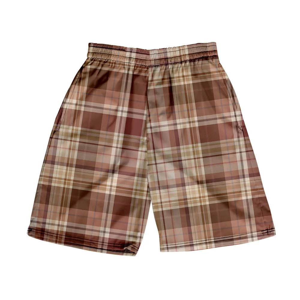 Man wearing straight-leg plaid shorts with an elastic waistband on a beach, showing one of twenty available colour variations.