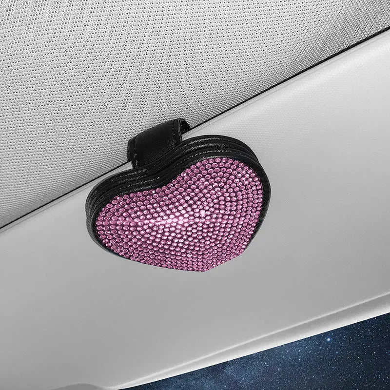 Black PU leather magnetic storage clip with diamond encrustment, shown attached to a car sun visor.