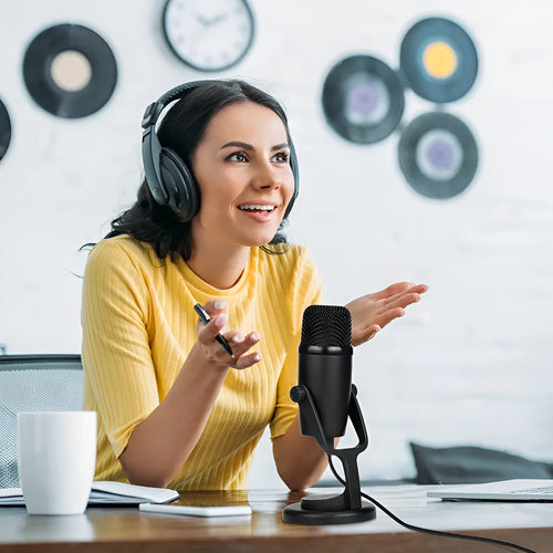 Black Boya BY-PM500 USB microphone with built-in sound card on a desk