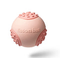 Green and pink durable rolling ball dog toy with a 64mm diameter on a plain background.