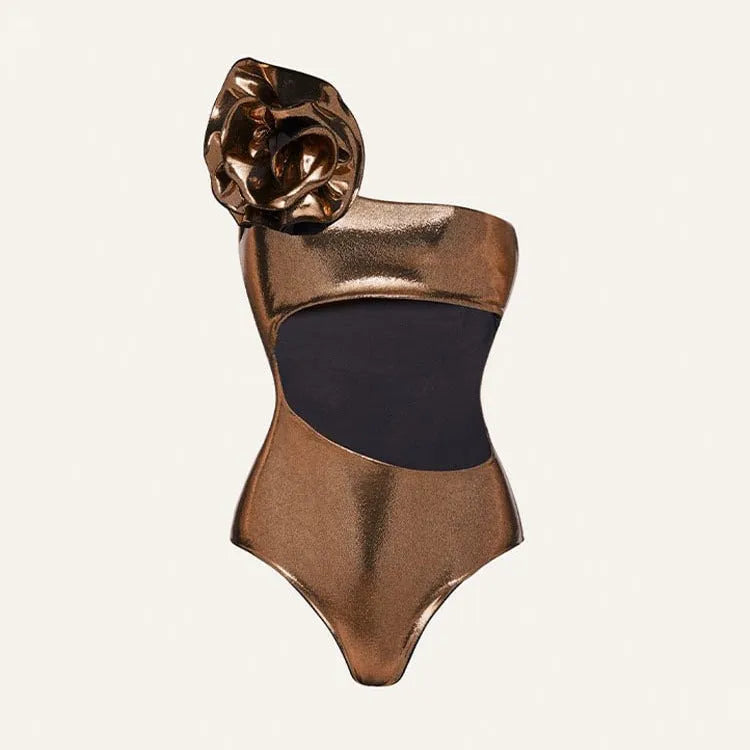 Gold handmade halter neck one-piece swimsuit with hollow-out detailing on a mannequin.