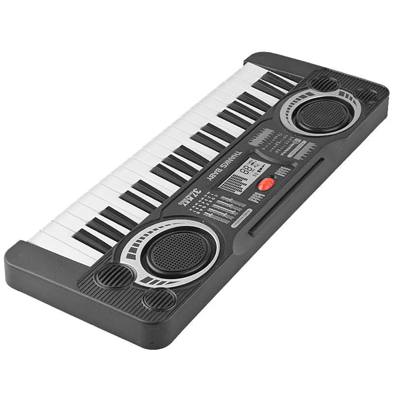 Children's 37-key electronic organ toy in black plastic on a table