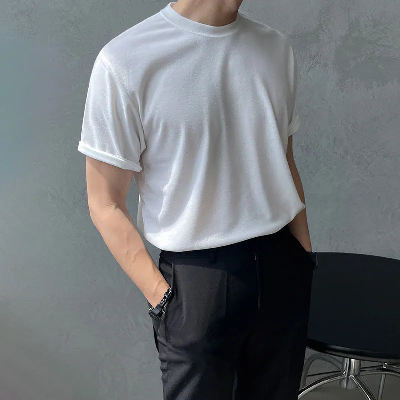 Men's slim fit cotton t-shirt in black on a hanger, showing round neck and half sleeve design.