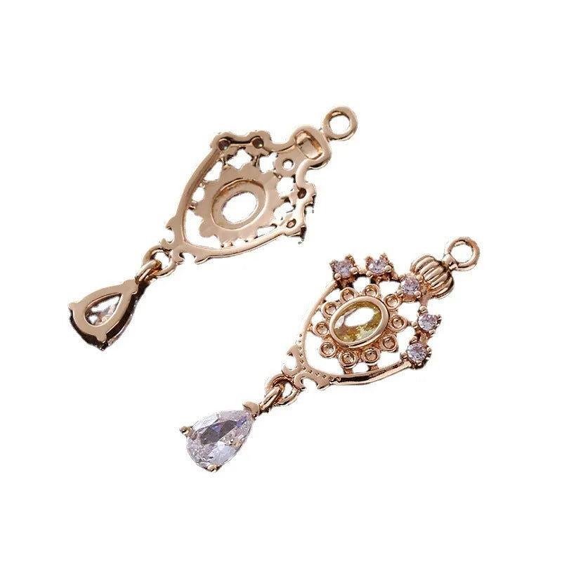 Micro inlaid zircon crown hollow water drop-shaped copper pendant in electroplated colour.