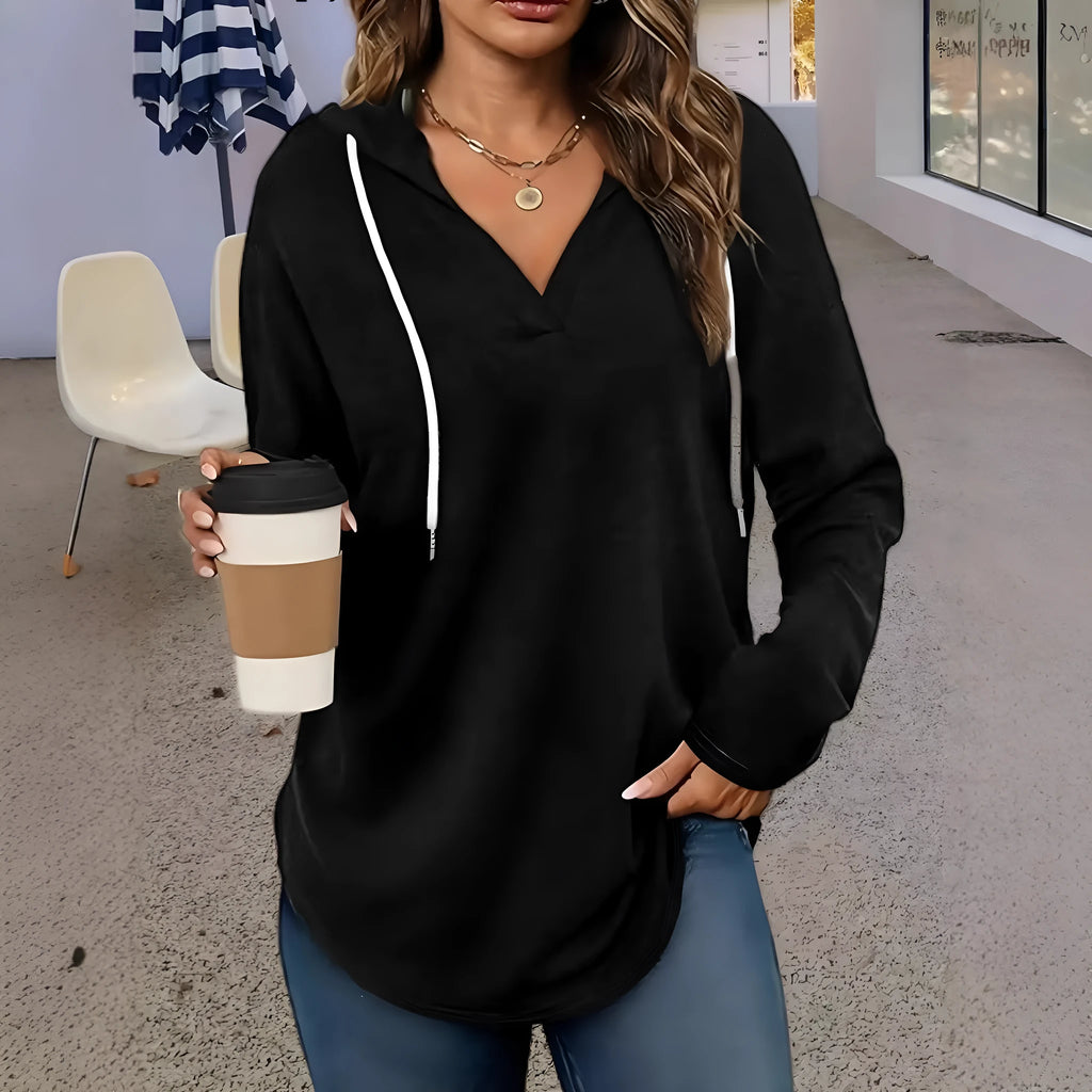 Red women's V-neck hooded sweatshirt with loose fit on a hanger, showing medium length.