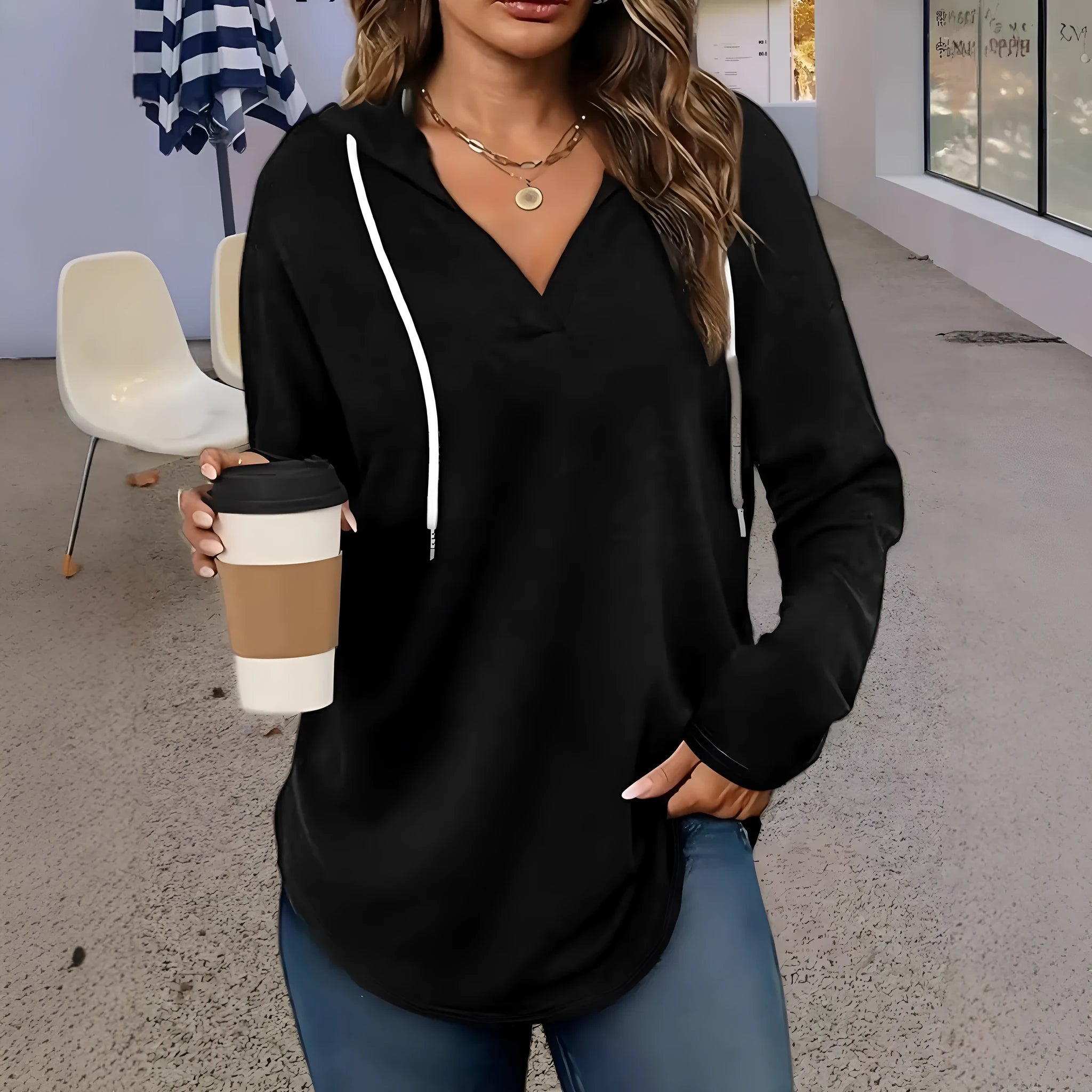 Red women's V-neck hooded sweatshirt with loose fit on a hanger, showing medium length.