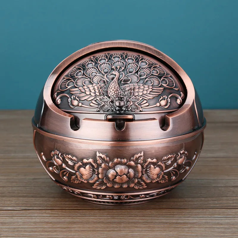 Bronze alloy ashtray with decorative fortune tree design and smoke extinguishing slot.