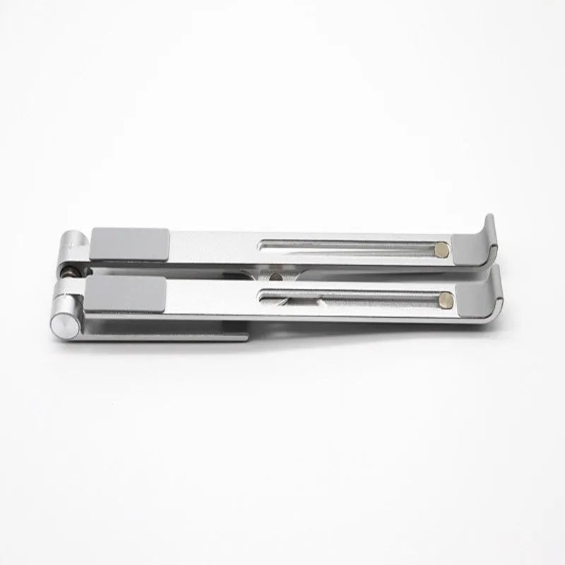 Black aluminium adjustable notebook stand for laptops on a desk.