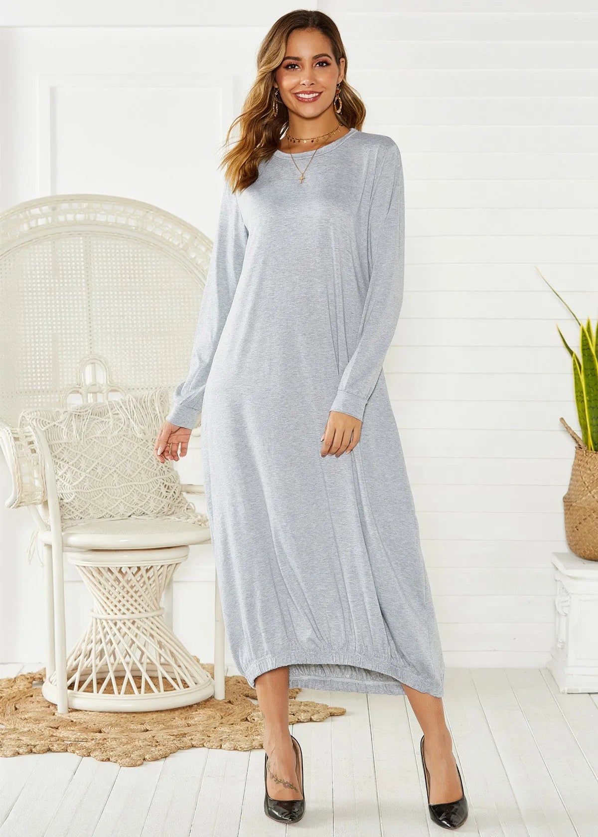 A loose-fitting black lantern dress for women with a lace-up crew neck.