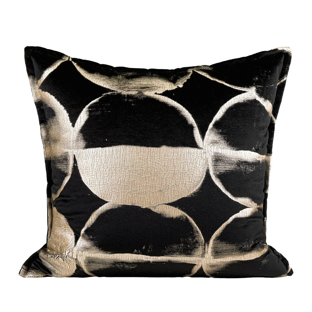 Black and gold abstract pattern flannel cushion cover on a sofa