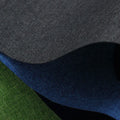 Roll of black polyester fabric with a white snowflake and dragon pattern, sold by the metre for covering projects.