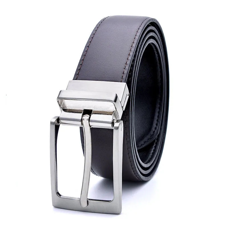 Men's brown and black genuine leather belt with a silver rotating pin buckle on a dark background.