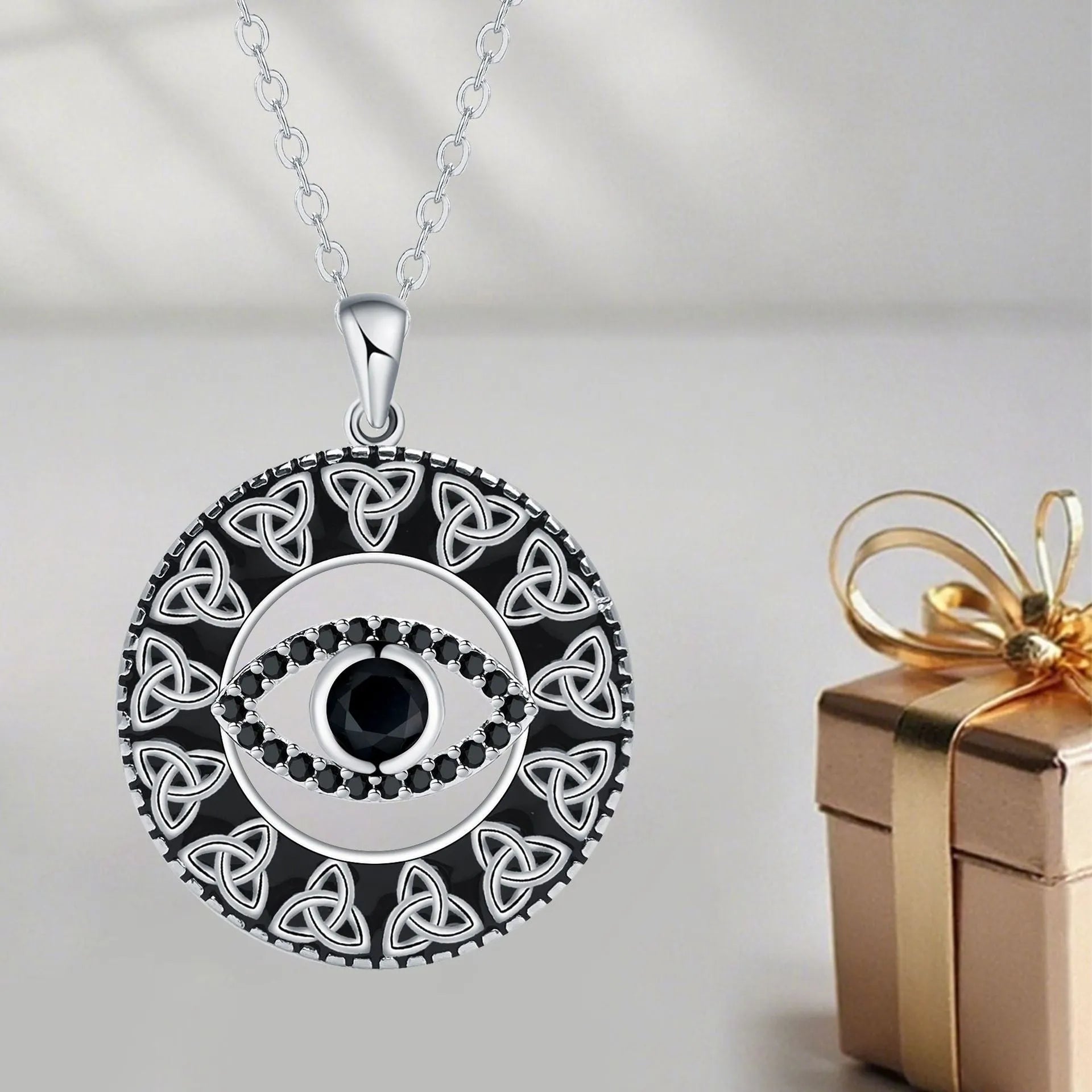 Copper Devil's Eye pendant necklace with electroplated finish on a cross chain for women.