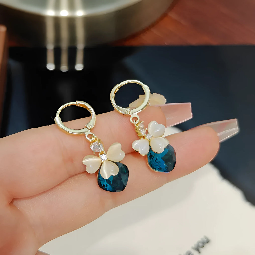 Women's blue crystal earrings with real gold plating bow shape and three-leaf flower motif