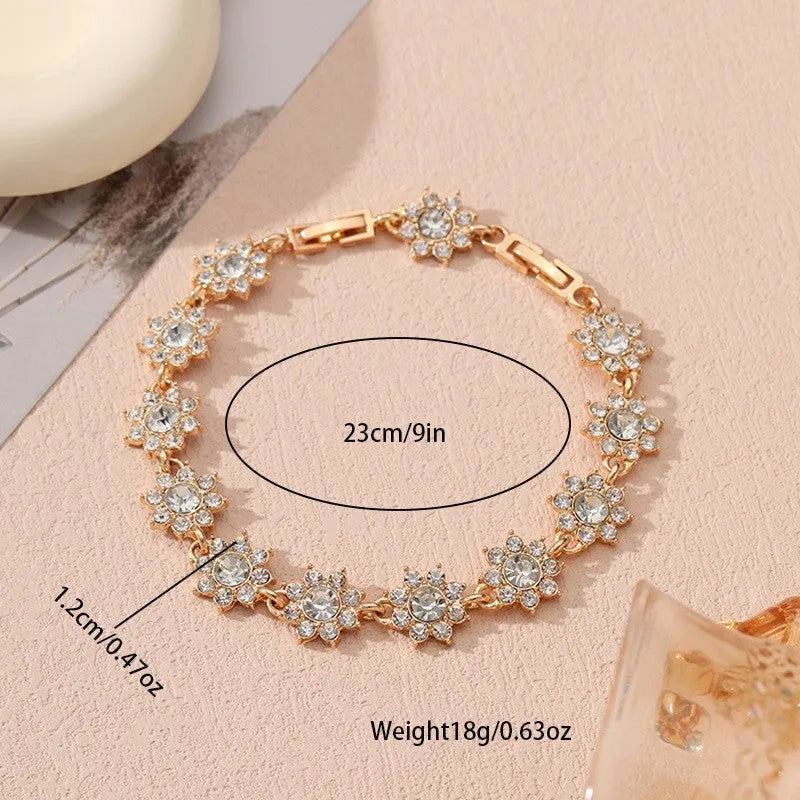 Floral zinc alloy bracelet in electroplated gold and silver colour variants with crystal and diamond effects