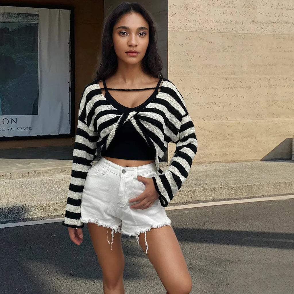 A striped long-sleeved pullover sweater in mercerised cotton, shown in one of five available colours.