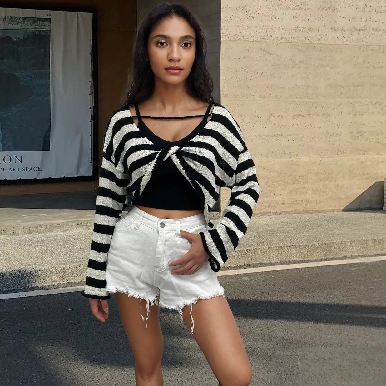A striped long-sleeved pullover sweater in mercerised cotton, shown in one of five available colours.
