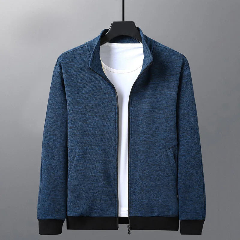 Man wearing a grey athletic-fit casual jacket with a stand-up collar and front zip.