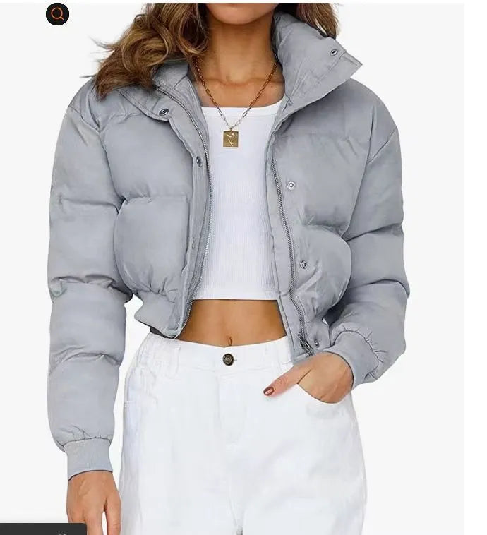 Loose blue polyester jacket for women with long sleeves on hanger