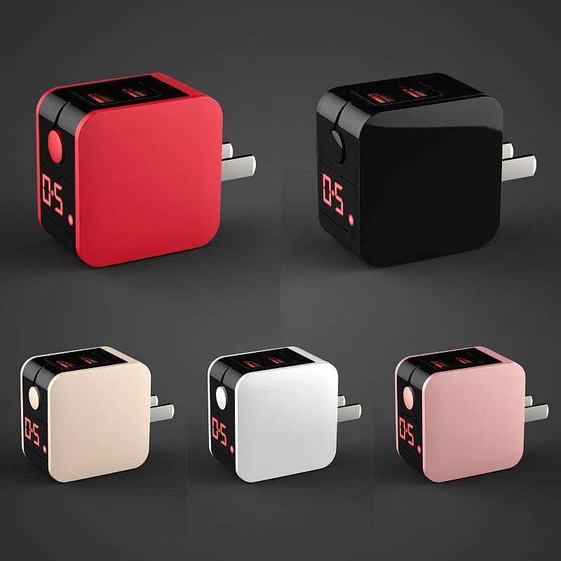 Black 5V2.4A dual USB fast charger with digital voltage display plugged into UK wall socket