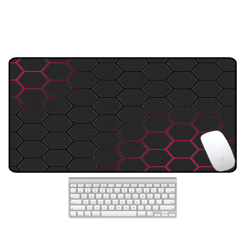 Large printed desk mouse pad with natural rubber non-slip base, shown on a wooden desk.