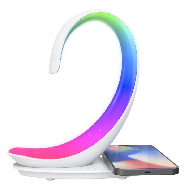 White swan-shaped desktop LED lamp with wireless charging pad and Bluetooth speaker.