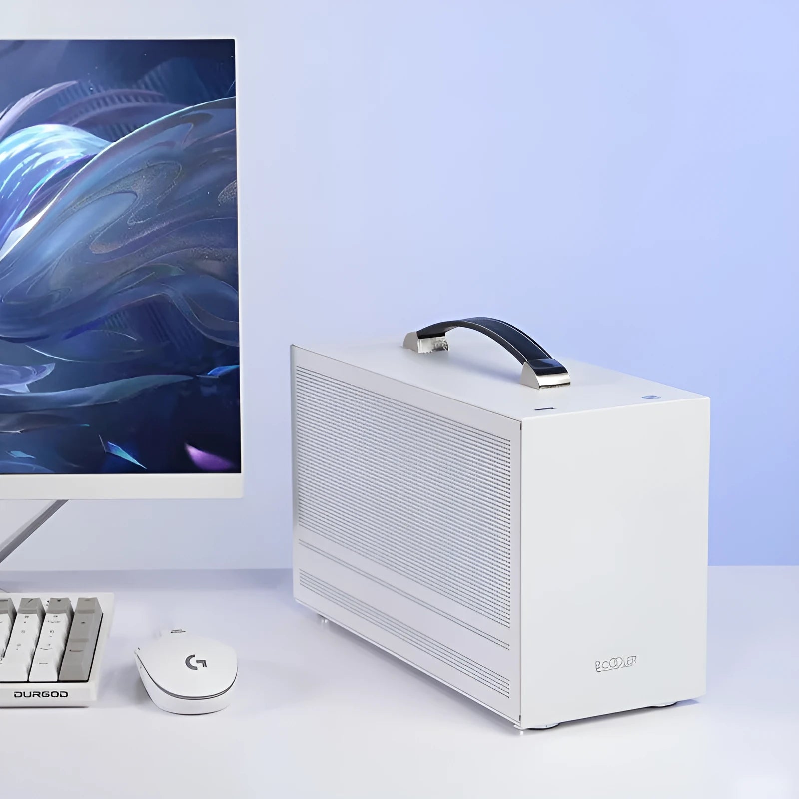 Three Hummingbird Portable mini-ITX desktop computer chassis in titanium grey and white finishes.