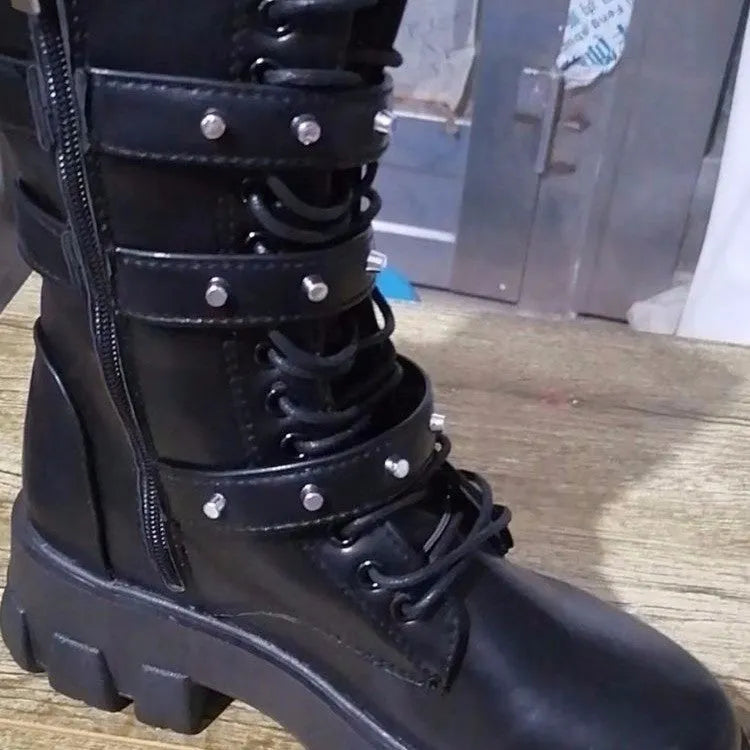 Women's black mid-calf buckle knight boots with side zipper on a white background.