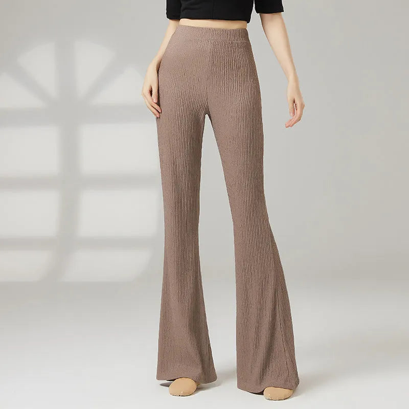 Adult female classical dance practice trousers in beige apricot, shown flat.
