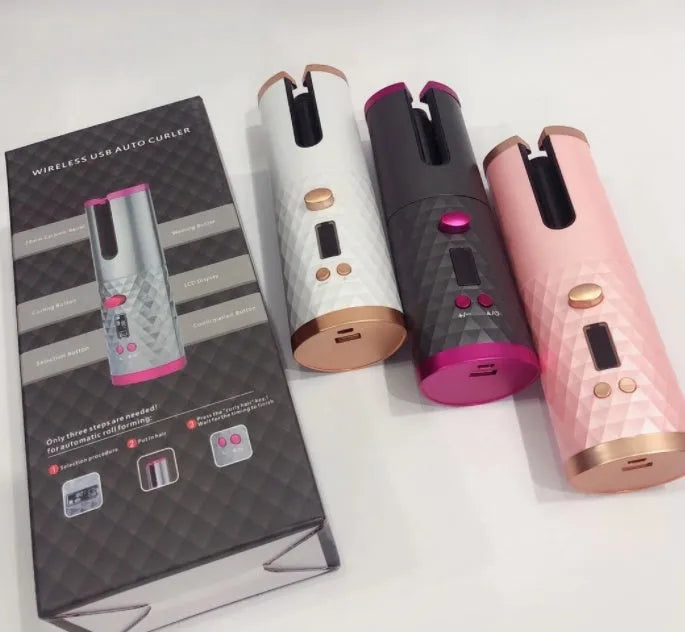 A white portable automatic wireless curling iron with a USB cable and a gold ceramic barrel.