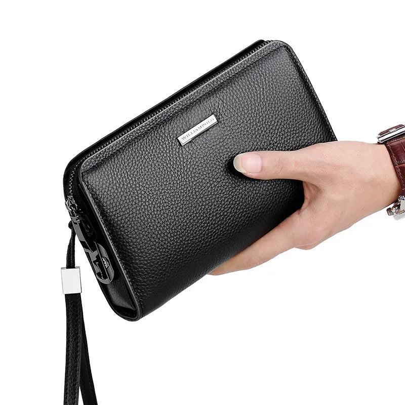 Men's black genuine leather clutch wallet open to show internal card slots, phone pocket, and zippered compartment.
