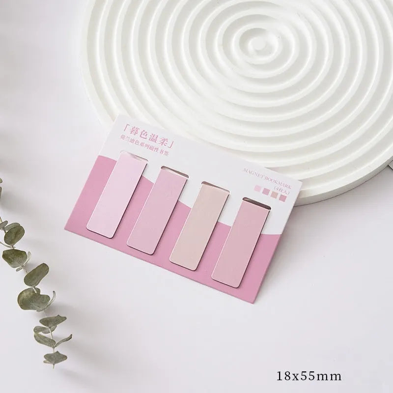 Set of four miniature magnetic bookmarks in soft Morandi series colour blocks on a white background.