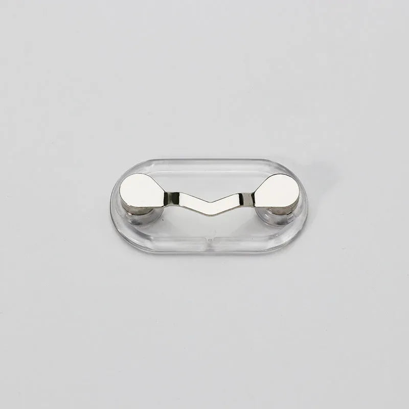 Black magnetic glasses holder on a fridge door with spectacles stored