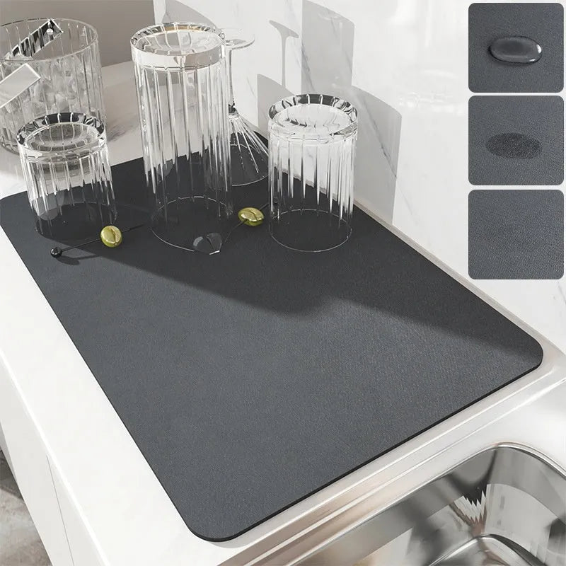Black square kitchen drain drying mat with anti-slip rubber backing on a countertop