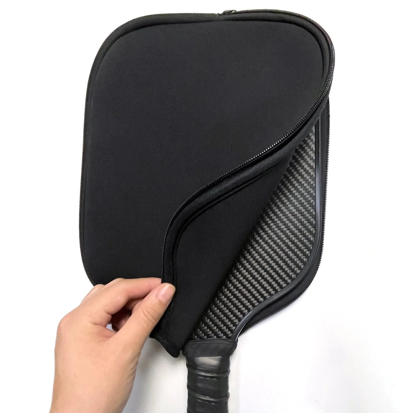 Black neoprene protective sleeve for a table tennis racket on a plain background