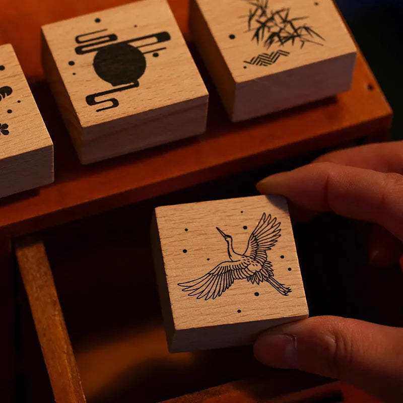 Wooden handled rubber stamp with hand-carved crane design for DIY paper crafting