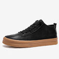 Men's black casual leather shoes with round toe and lace-up front on a white background.