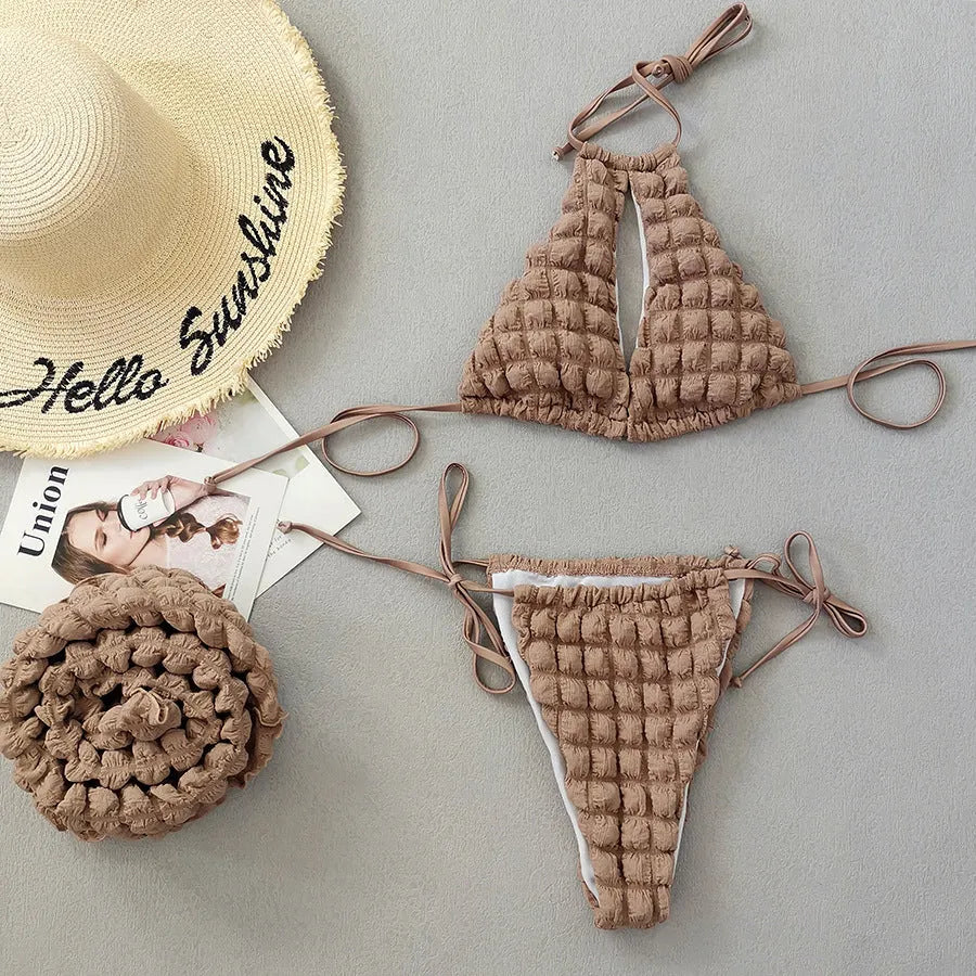 Brown seersucker three-piece women's bikini swimsuit with lace-up design on mannequin