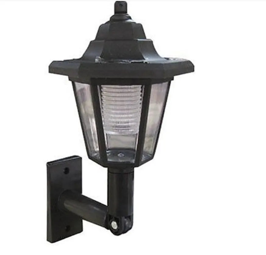 Black hexagonal solar-powered wall light with LED and solar panel for outdoor use