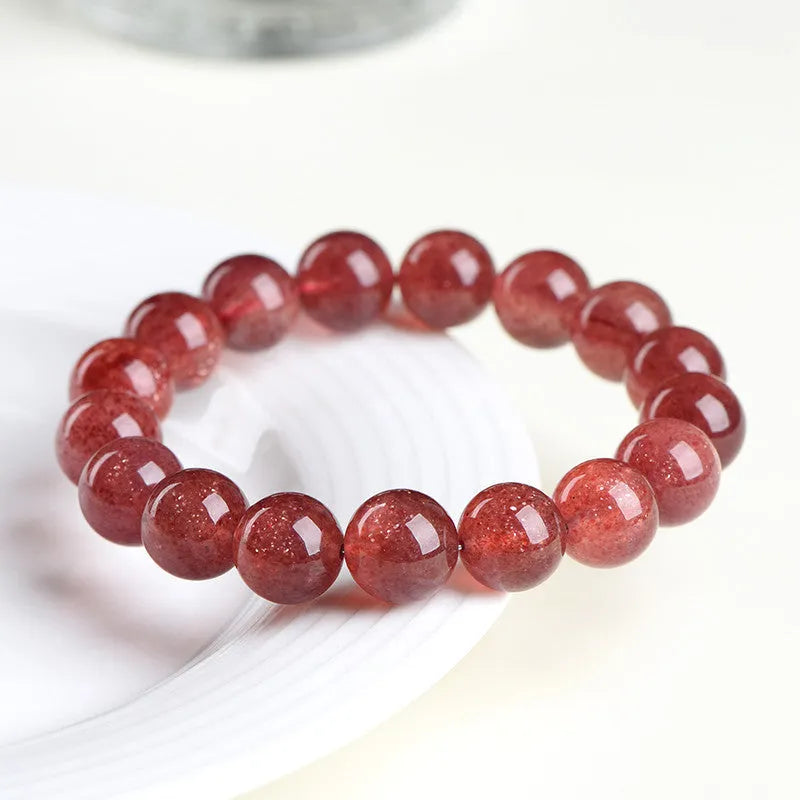 Natural cherry red strawberry quartz bracelet with geometric beads showing starlight effect