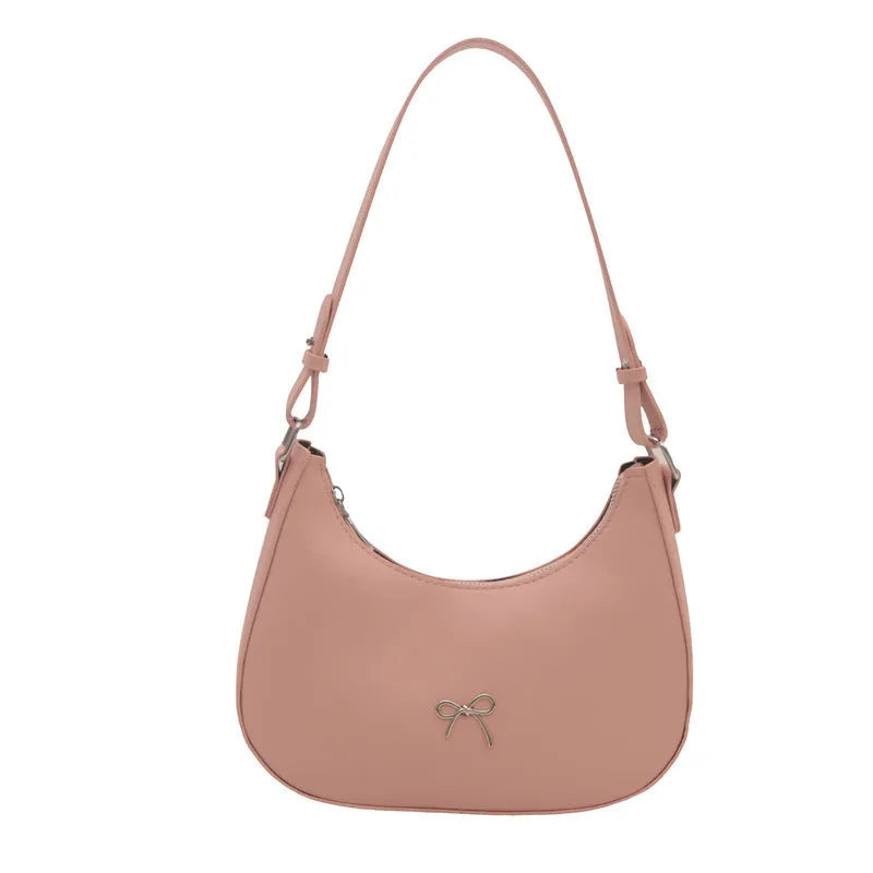 Women's black dumpling-shaped PU shoulder baguette handbag with a single strap and sewing thread detail.