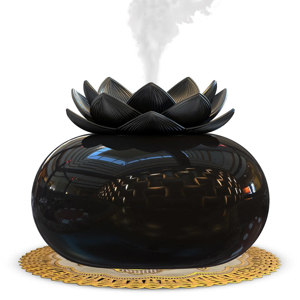 Pure black round Lotus ultrasonic aromatherapy humidifier with USB cable.