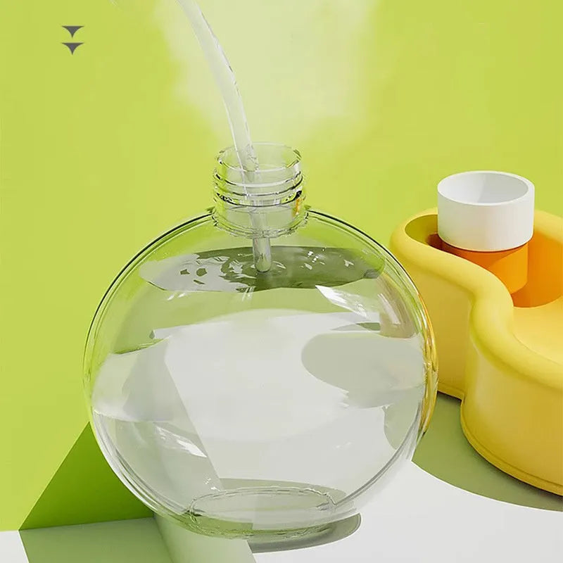 Green portable dog water bottle with fold-out drinking bowl for travel.