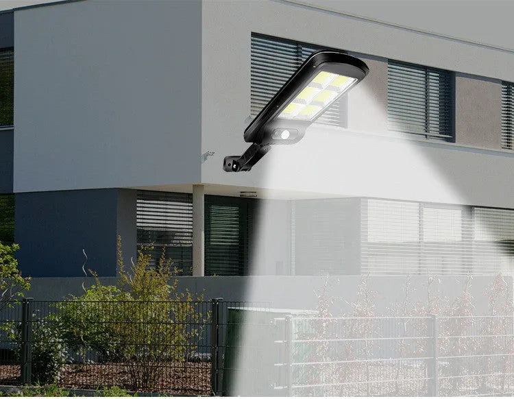 Black solar-powered outdoor motion sensor light with IP65 waterproof rating for garden and driveway security.