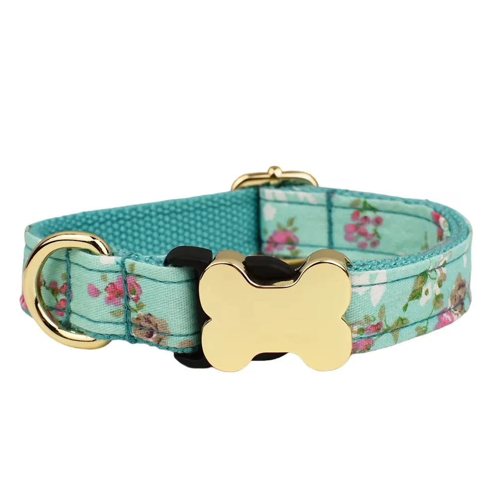 Flat nylon dog collar with printed grid pattern and white bone-shaped plastic buckle on a blue background.
