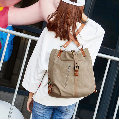 Canvas handbag with anti-theft device, woven detail, soft handle and curved shoulder strap in horizontal square shape