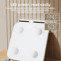 White smart body fat scale with 8 electrodes and LED display on tempered glass platform